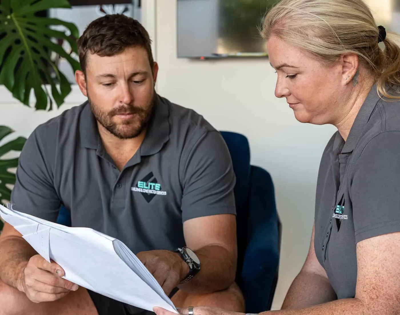 Nathan and Jamie going through plans with a client