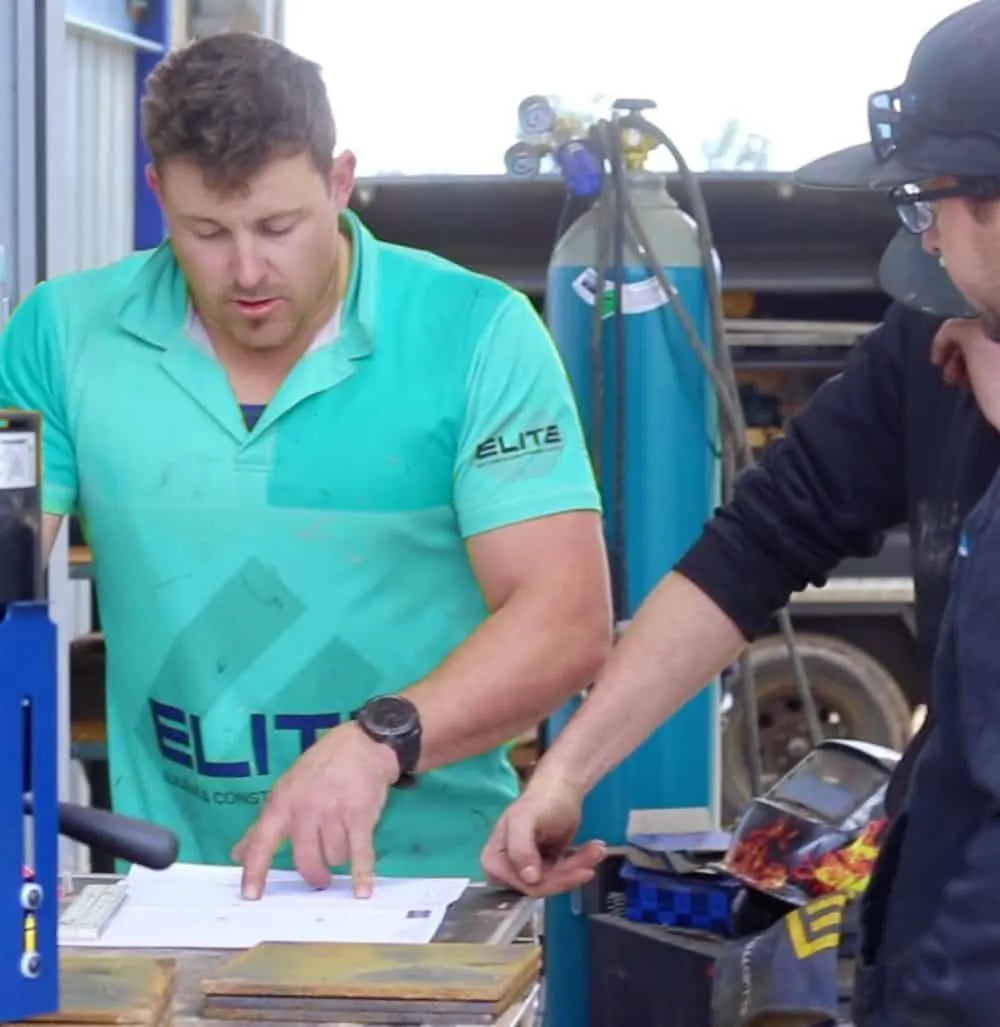 Nathan Hooper reviewing plans on site