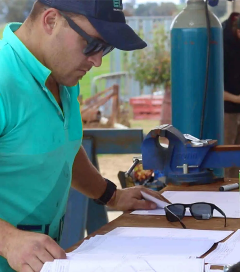 Nathan reviewing plans on site